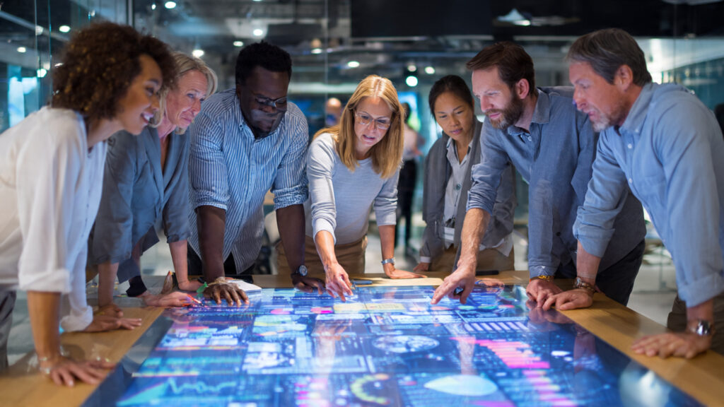 a diverse leadership team collaborating around a